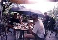Graham and Stuart eating in the rain HK